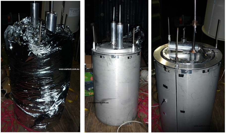 The Mylar sheet was partially unwrapped and then lifted over the top of the inside vessels. The 'Liquid Nitrogen Vessel' and 'Liquid Helium Vessel' as well as fill tubes are held in position using an aluminium top plate. The top plate was removed which completely detached the 'Liquid Nitrogen Vessel' from the remaining cylinders.