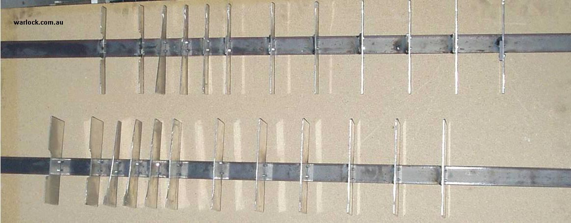 Wind turbine cross sections aligned and bolted to a frame.